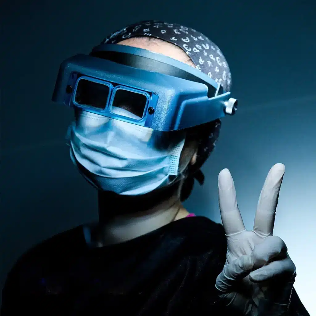 Cosmedica team member in surgical gear throwing a_y