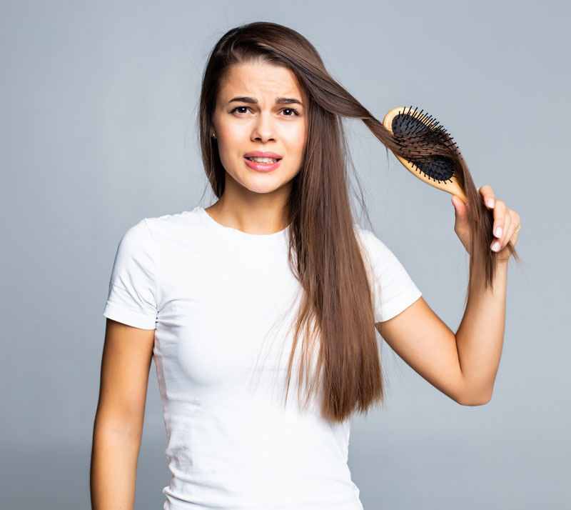 young-woman-problems-with-hair-split-weak-hair-tangled-hair-isolated-grasy